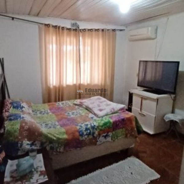 TERRENO COM DUAS CASAS ALVENARIA